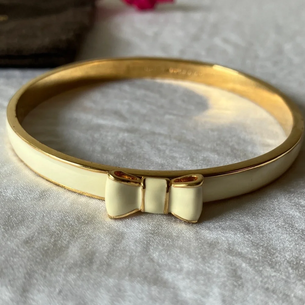 Kate Spade: “Take a Bow” Cream & Gold Tone Bow Bracelet & Dust Bag - Picture 3 of 11